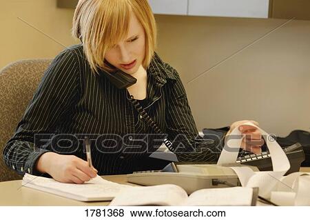 Picture - Trying to balance the books. Fotosearch - Search Stock Photos, Images, Print Photographs, and Photo Clip Art