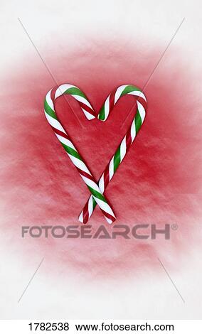 Two heart shaped candy canes View Large Photo Image Stock Photo - Two heart shaped candy canes. Fotosearch
