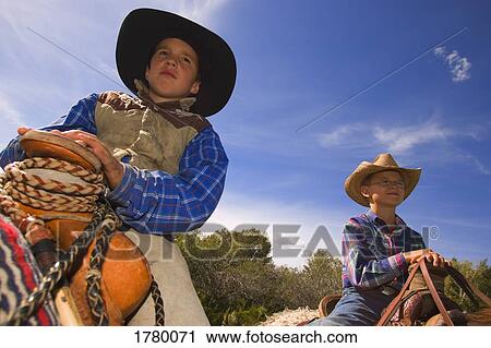 Stock Image - Two young cowboys. Fotosearch