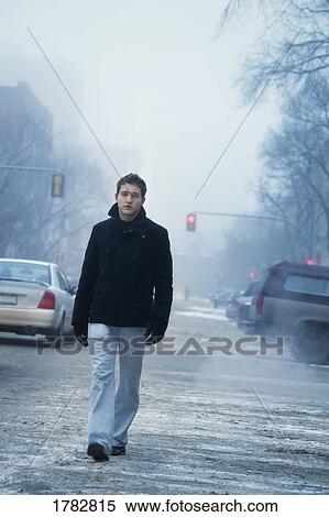 Stock Photography - Walking down the Street in the fog. Fotosearch