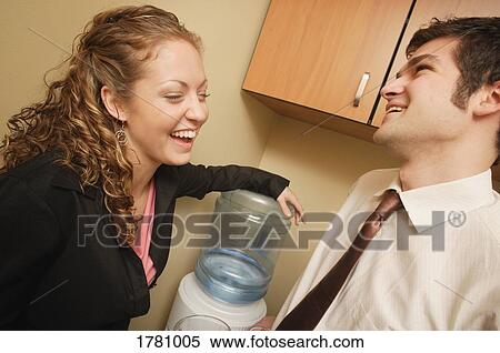 Water cooler talk View Large Photo Image Stock Photography - Water cooler talk. Fotosearch