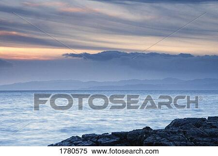 Stock Photography - Water with mountain in background. Fotosearch
