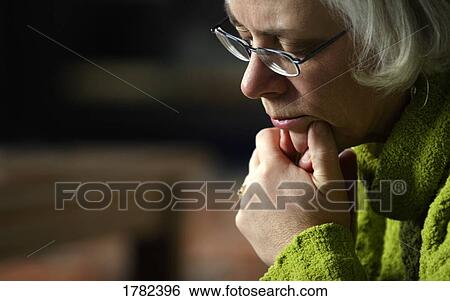 Woman deep in thought View Large Photo Image Stock Photograph - Woman deep in thought. Fotosearch