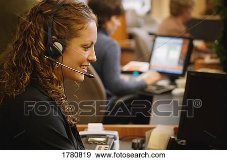 Stock Photo - Woman on headset. Fotosearch