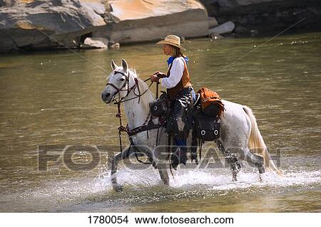 Picture - Woman on horseback. Fotosearch