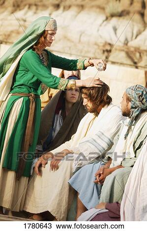 Stock Image - Woman pours oil on Jesus' head. Fotosearch