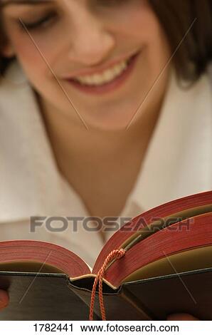 Woman reading a book View Large Photo Image Stock Image - Woman reading a book. Fotosearch