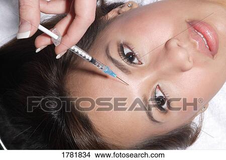 Woman receiving anti-aging treatments View Large Photo Image Picture - Woman receiving anti-aging treatments. Fotosearch