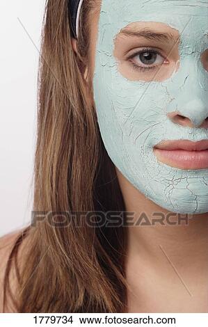 Woman with a facial masque View Large Photo Image Picture - Woman with a facial masque. Fotosearch