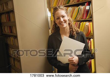 Woman with a file folder View Large Photo Image Stock Image - Woman with a file folder. Fotosearch