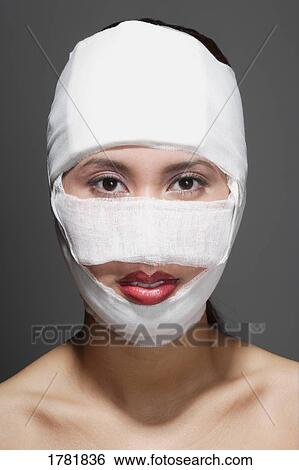 Stock Photograph - Woman with bandages. Fotosearch