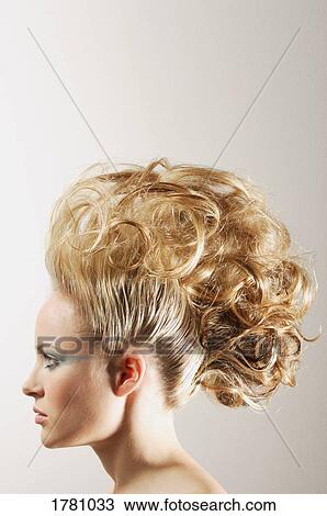 Stock Image - Woman with high fashion hair style. Fotosearch