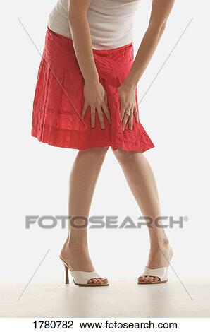 Stock Image - Woman with red skirt. Fotosearch