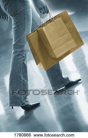 Stock Photograph - Woman with shopping bags. Fotosearch