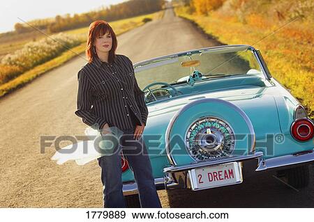 Woman with vintage car View Large Photo Image Stock Photo - Woman with vintage car. Fotosearch