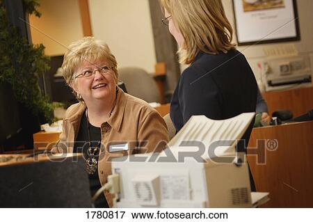 Stock Photo - Women at work. Fotosearch