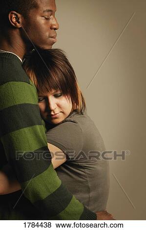 Stock Photo - A couple embracing. Fotosearch