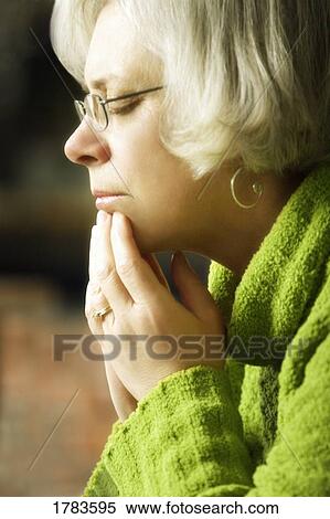 Stock Photography - A woman Praying. Fotosearch