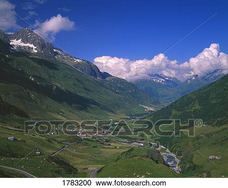Alpine valley with village in Swiss Alps View Large Photo Image Stock Image - Alpine valley with village in Swiss Alps. Fotosearch
