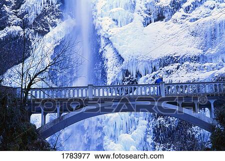 Stock Photo - Bridge and Multnomah Falls in winter, Columbia River Gorge.. Fotosearch