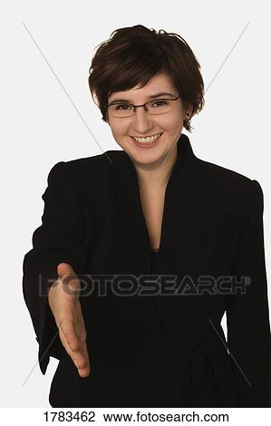 Stock Image - Businesswoman with hand outstretched. Fotosearch