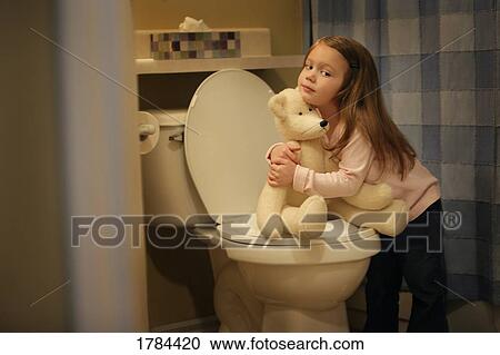 Child encourages bear to go potty View Large Photo Image Stock Image - Child encourages bear to go potty. Fotosearch