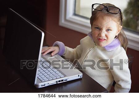 Picture - Child frustrated with computer. Fotosearch