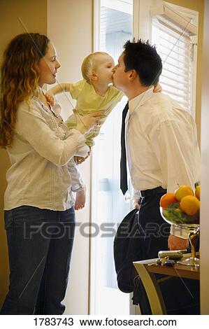 Stock Image - Child kisses father good-bye. Fotosearch