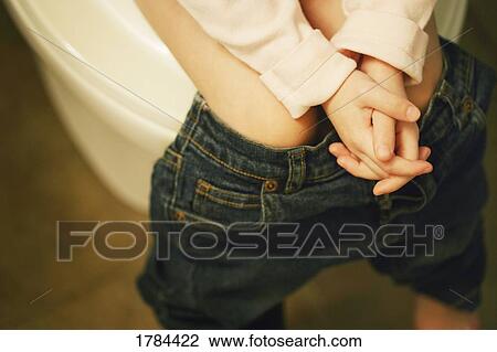 Stock Image - Child sits on potty. Fotosearch