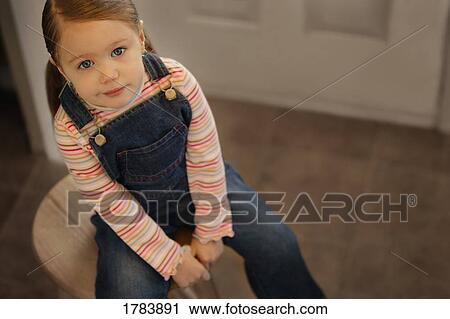 Stock Image - Child with a smirk. Fotosearch