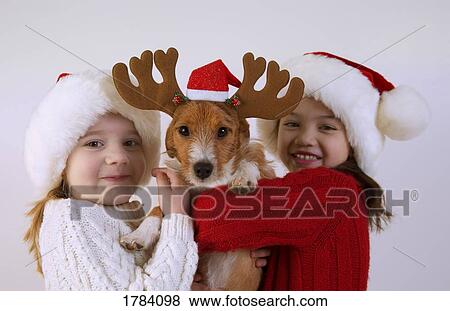 Stock Photo - Children and dog with antlers. Fotosearch