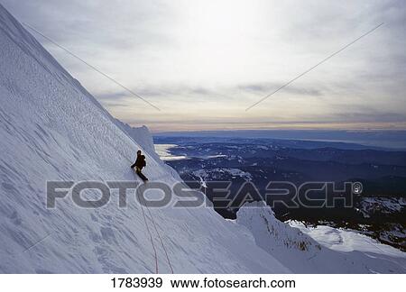 Stock Photo - Climber on Reid Glacier, Mount Hood. Fotosearch