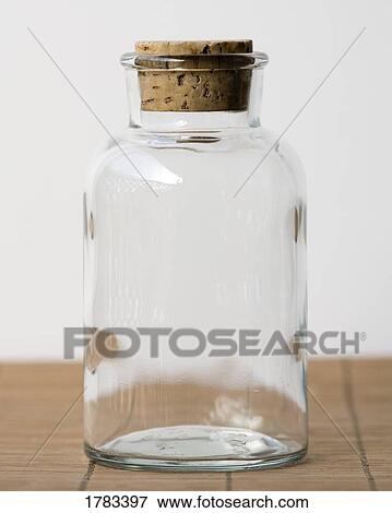 Stock Photo - Empty clear glass jar with cork stopper . Fotosearch