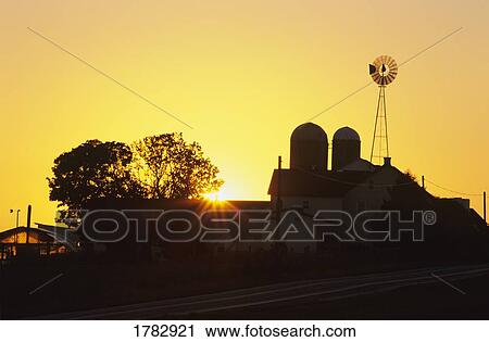 Farm silhouette at sunrise View Large Photo Image Stock Image - Farm silhouette at sunrise. Fotosearch
