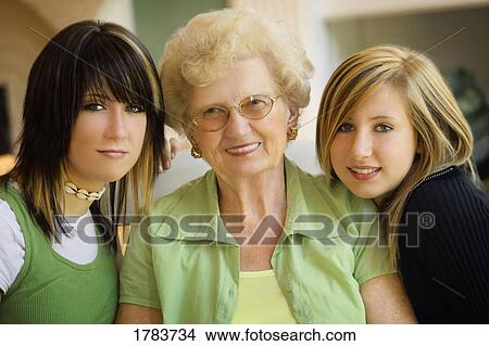 Picture - Girls with grandmother. Fotosearch