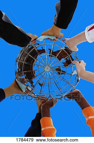 Stock Photo - Hands on the globe. Fotosearch