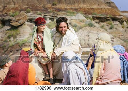 Stock Photograph - Jesus spends time with children. Fotosearch