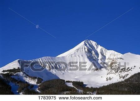 Stock Photography - Lone Peak view with moon above. Fotosearch
