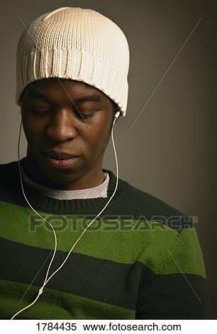 Man listening to music View Large Photo Image Stock Photography - Man listening to music. Fotosearch