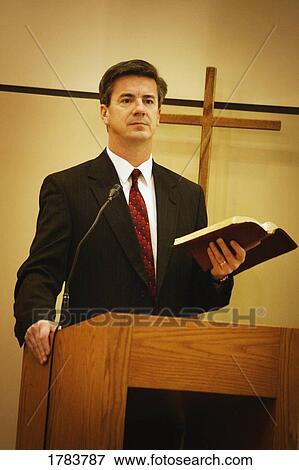 Pastor preaching from pulpit View Large Photo Image Stock Photo - Pastor preaching from pulpit. Fotosearch
