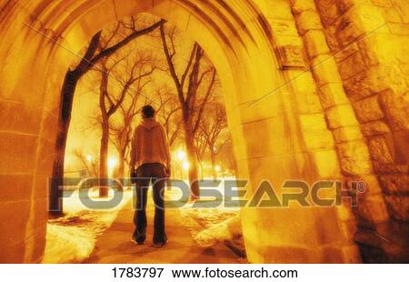 Person walking away from structure View Large Photo Image Stock Photo - Person walking away from structure. Fotosearch