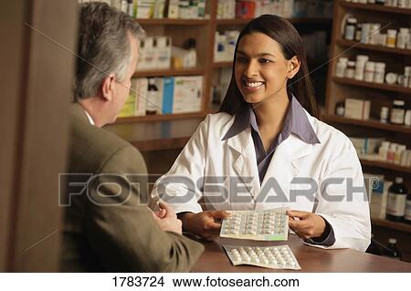 Pharmacist with patient View Large Photo Image Picture - Pharmacist with patient. Fotosearch