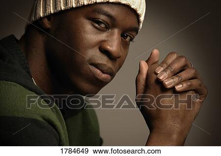 Stock Photo - Portrait of a young adult man. Fotosearch
