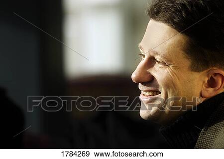 Stock Photo - Portrait of smiling man. Fotosearch