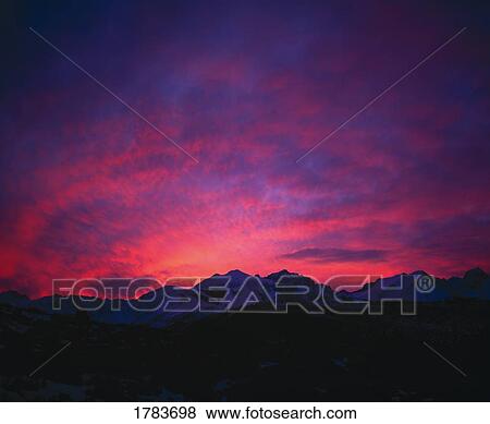 Stock Photo - Red sunrise over Sierra Nevada Mountains. Fotosearch