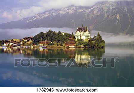 Stock Image - Scenic mountain lake and town. Fotosearch