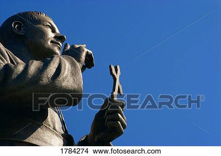 Statue holding cross View Large Photo Image Picture - Statue holding cross. Fotosearch