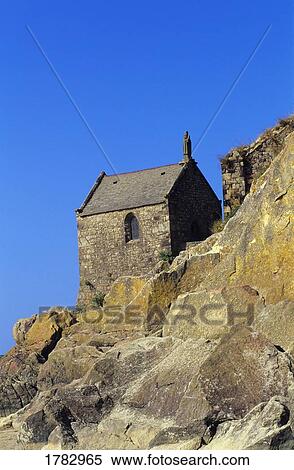Stock Photography - Stone Chapel on Cliff Mont Saint Michel. Fotosearch
