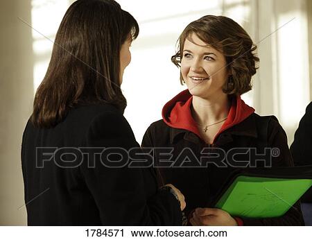 Stock Image - Teacher and student interacting. Fotosearch