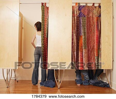 Stock Photo - Trying on jeans in change room. Fotosearch